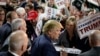 Republican presidential candidate Donald Trump greets supporters after speaking at a rally at Muscatine High School in Muscatine, Iowa, Jan. 24, 2016.