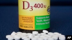 Vitamin D pills are displayed, Wednesday, Nov. 9, 2016, in New York. Doctors are warning about vitamin D again, and it isn't the "we need more" news you might expect.
