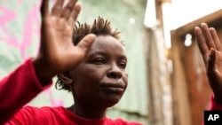 Winnie Makinda wails as she tells how a bulldozer killed her son, Ian Otieno, in Nairobi, May 8, 2024. The Kenyan government last week ordered the demolition of structures within 30 meters of rivers. Otieno, 17, was crushed while he was inside a church helping save property.