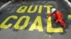 FILE - Activists protest the use of coal in the Philippines, June 3, 2008. Decreasing the world's reliance on coal and other fossil fuels is key to global health, said participants Thursday at the World Climate Summit in Washington.