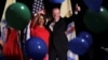 FILE - Phil Murphy, Governor-elect of New Jersey, and Shiela Oliver, Lieutenant Governor-elect, wave to supporters at their election night victory rally in Asbury Park, New Jersey, Nov. 7, 2017. 