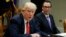 Treasury Secretary Steven Mnuchin listens as President Donald Trump speaks during a meeting on the Federal budget, Feb. 22, 2017, in the Roosevelt Room of the White House in Washington.