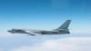 资料照：由日本空中自卫队2013年10月27日拍摄、日本防卫厅公布的照片显示，一架中国轰-6轰炸机从冲绳本岛和宫古岛之间的空域飞过。