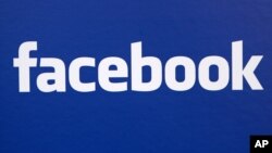FILE - In this Nov. 6, 2007 file photo, the Facebook logo is displayed at a Facebook announcement in New York. 