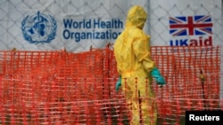 A person dressed in Ebola protective apparel is seen inside an Ebola care facility at the Bwera general hospital near the border with the Democratic Republic of Congo in Bwera, Uganda, June 14, 2019.