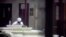 An unidentified prisoner reads a newspaper in a communal cellblock at Camp VI, a prison used to house detainees at Guantanamo Bay U.S. Naval Base, March 5, 2013