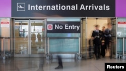 An Iceland Air flight crew arrives on the day that U.S. President Donald Trump's limited travel ban, approved by the U.S. Supreme Court, goes into effect, at Logan Airport in Boston, Massachusetts, June 29, 2017. 