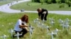 On a hillside near the Branch Davidian compound outside Waco, Rhiannon Gardner of Thousand Palms, Calif. and Linda Caliva of San Diego erect crosses, April 26,1993, for the cult members that died in the fire and for the four ATF agents that were killed in