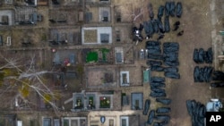 Буча: полицейские идентифицируют погибших мирных жителей (архивное фото) 